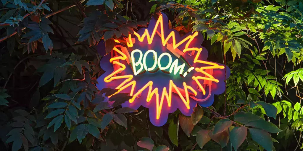 Pop Art-inspired neon sign that says BOOM!