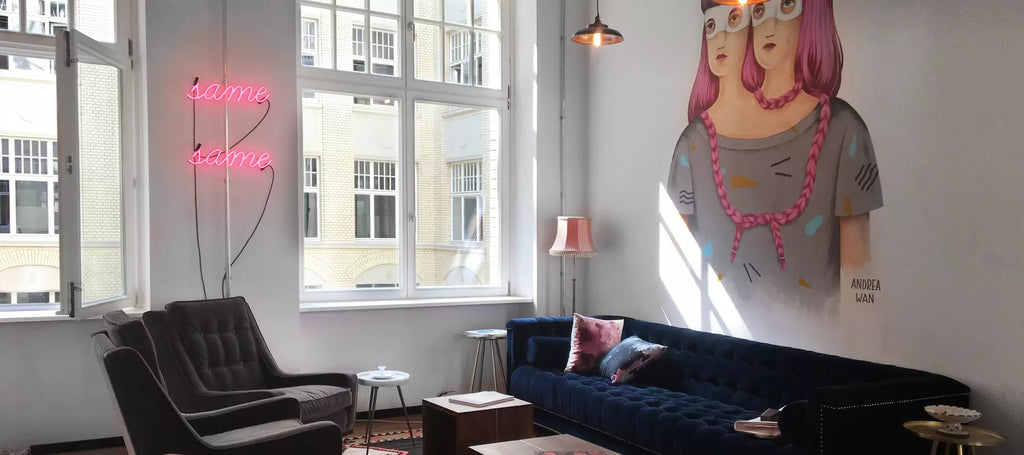 Mindspace sitting area with pink glass neon sign