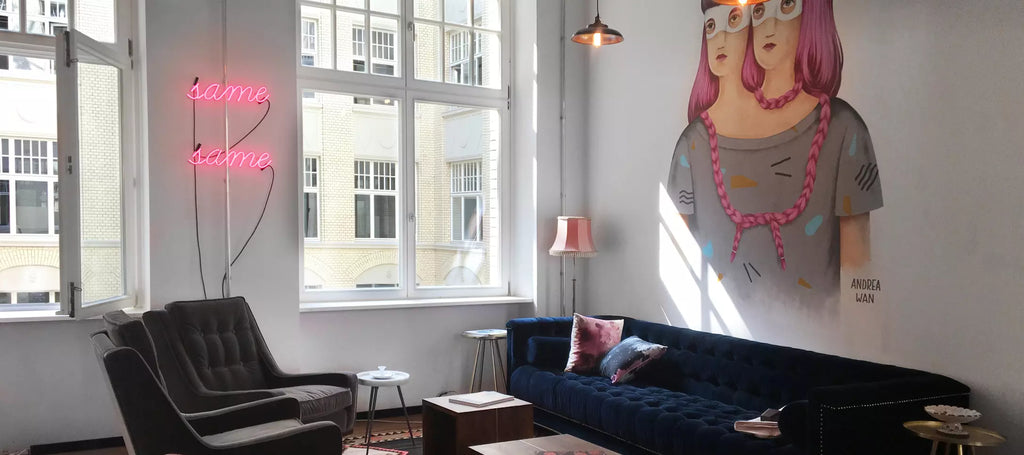 Mindspace sitting area with pink glass neon sign 