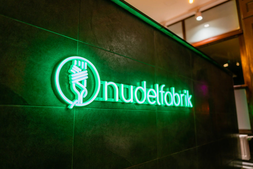 nudelfabrik in dresden name and logo in green led neon