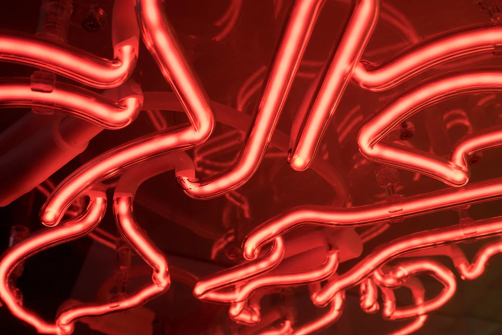red glowing glass neon tubes detail shot